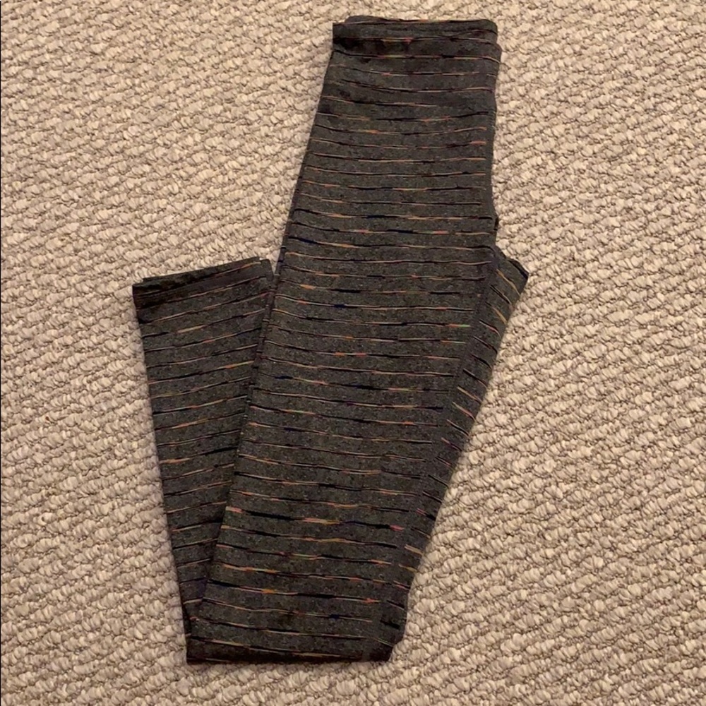 Grey leggings with colorful horizontal stripes